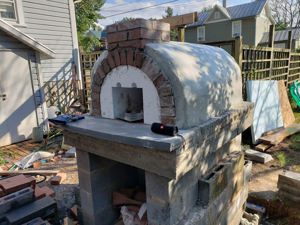https://www.revolutionarygardens.com/wp-content/uploads/2018/12/almost-finished-brickwood-oven-1024x768.jpg